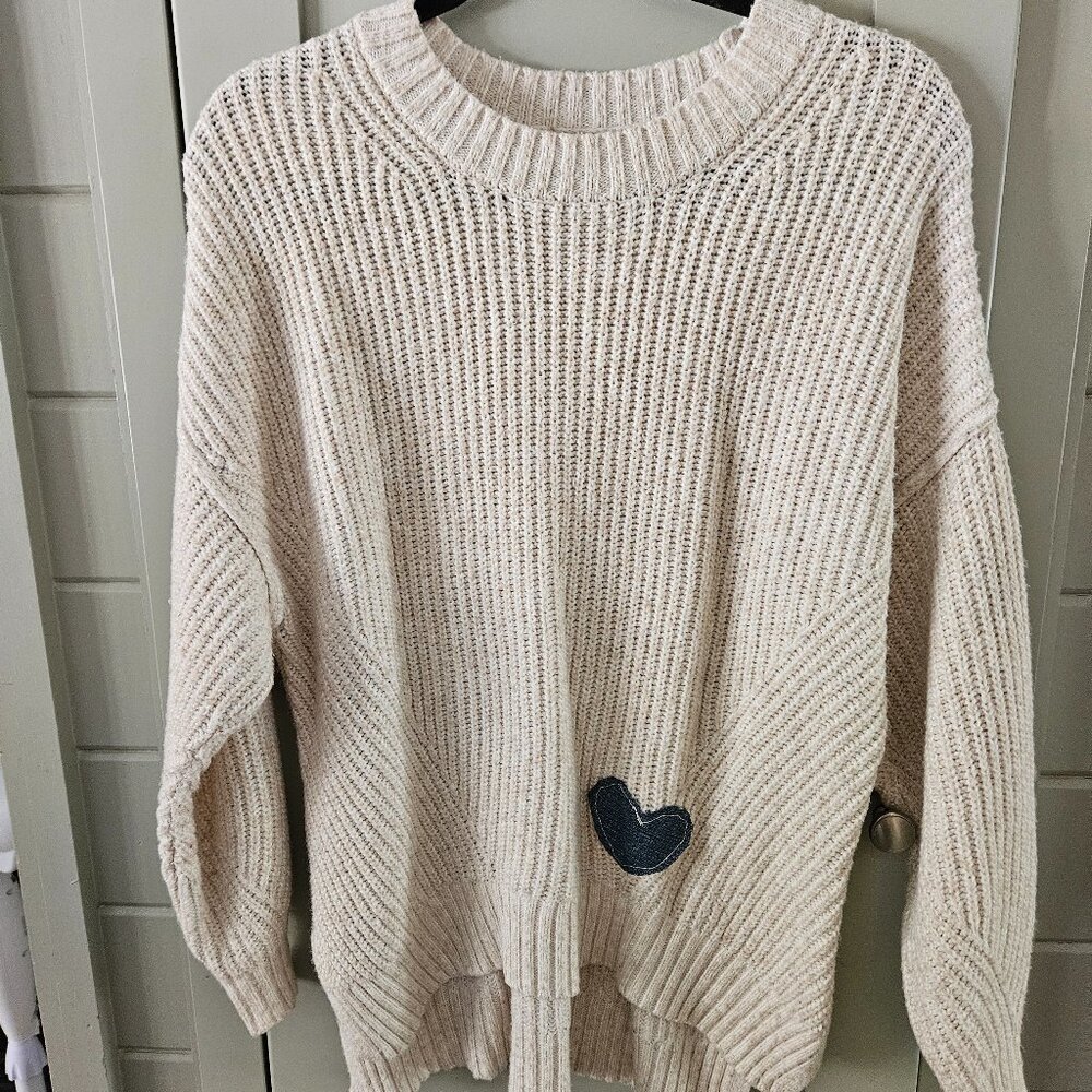 Elegant Beige Sweater with Heart Accent